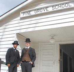 Mr. Booker T. Washington (left), portrayed by Shaban Ghaffur and Mr. Julius Rosenwald, portrayed by Bryan Lee, welcome guests into the Pine Grove School.- Photos by Lisa Smarr 